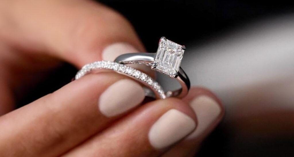 solitaire engagement ring in dallas, tx paired with a diamond wedding band